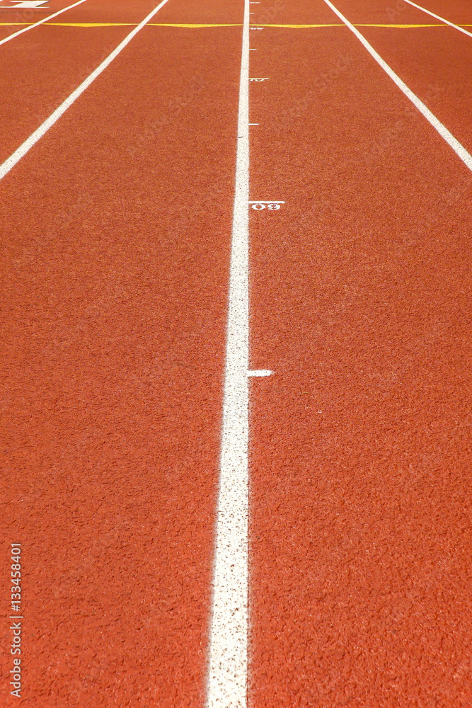 Indoor running track with racing lanes