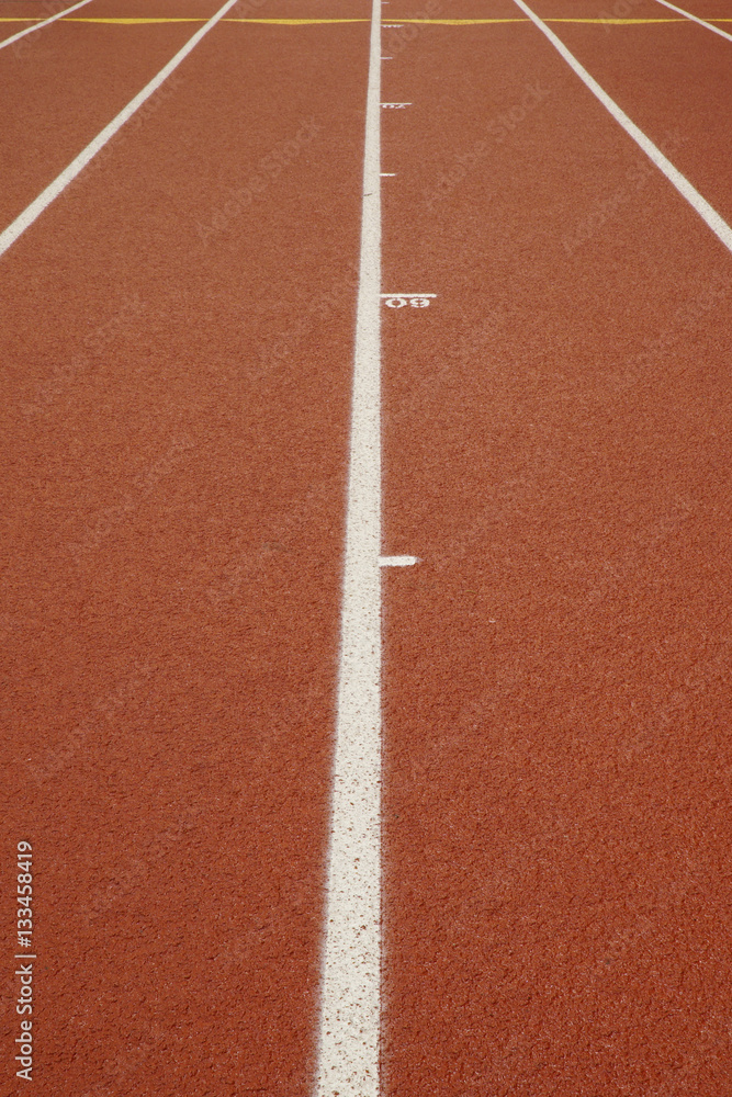 Indoor running track with racing lanes