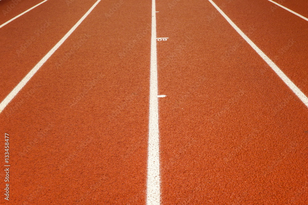Indoor running track with racing lanes