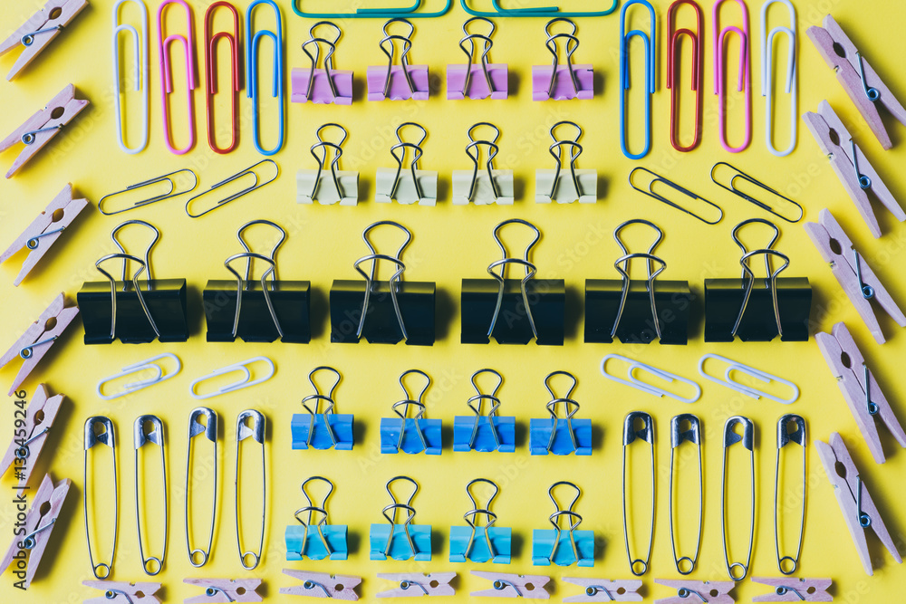 Pins and paper clips collection, yellow background Pins and paper clips collection, yellow background
