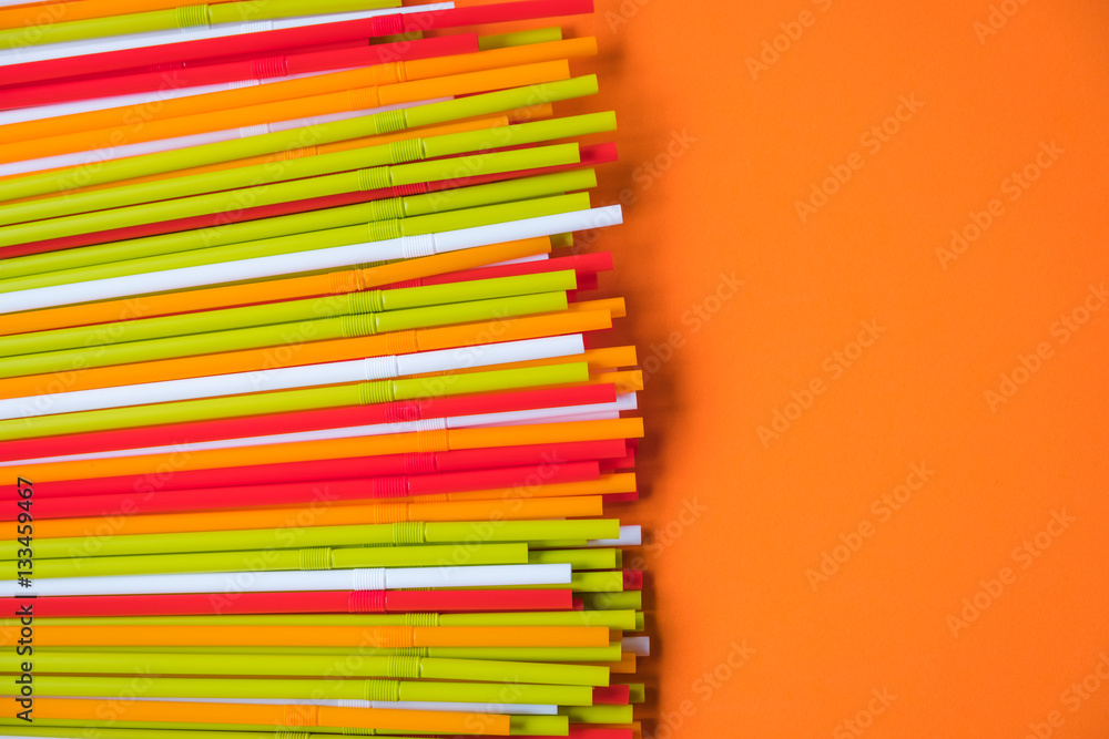 Fototapeta premium Colorful drinking straws for the color background. Abstract a colorful of plastic straws used for drinking water or soft drinks