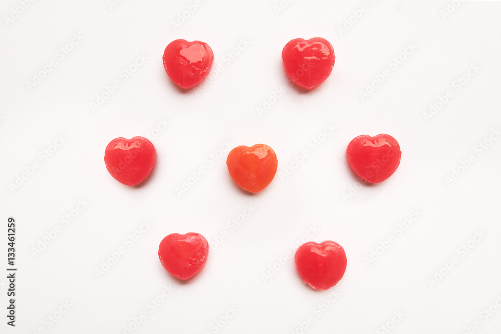 Red Valentine's day heart shape candy pattern on empty white paper background. Love Concept. colorful hipster style. Knolling top view. Red Valentine's day heart shape candy pattern on empty white paper background. Love Concept. colorful hipster style. Knolling top view.