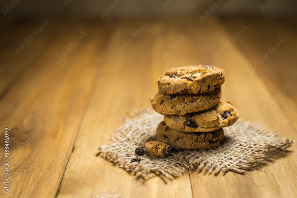 Chocolate cookies on a cloth sack on wood. Chocolate chip cookie Chocolate cookies on a cloth sack on wood. Chocolate chip cookie