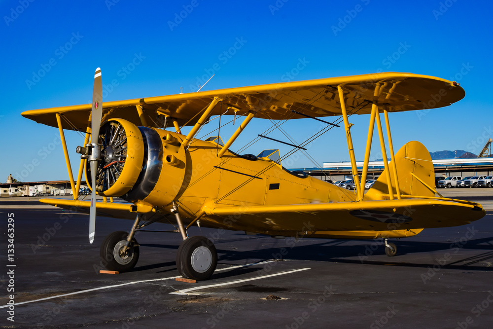 Yellow Biplane in an Airshow - obrazy, fototapety, plakaty 