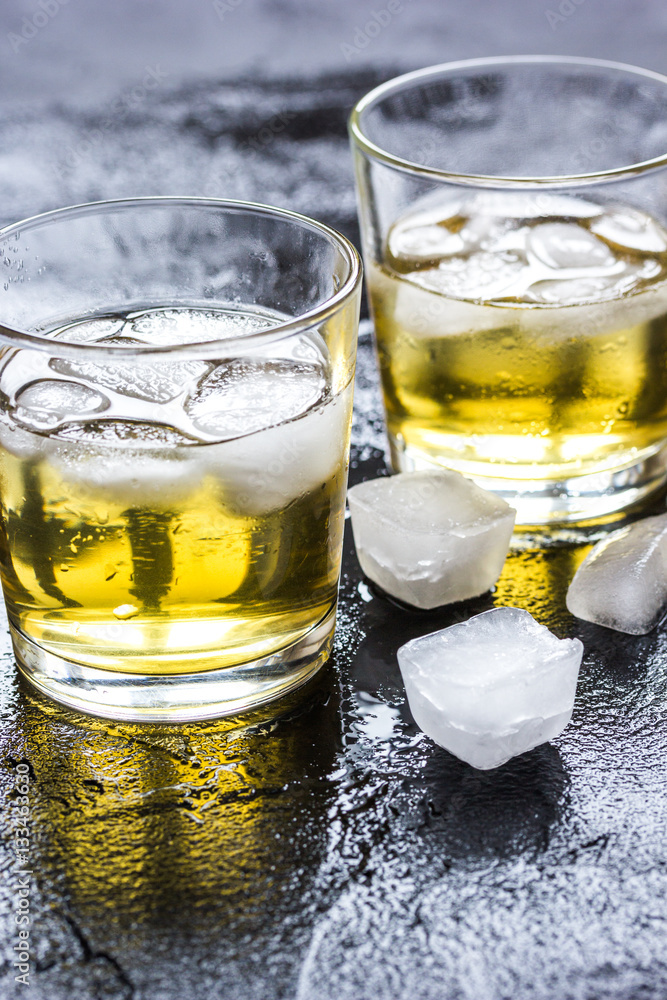 glass of whiskey on dark background glass of whiskey on dark background