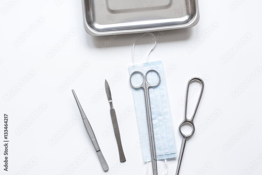 instruments for plastic surgery on white background top view instruments for plastic surgery on white background top view