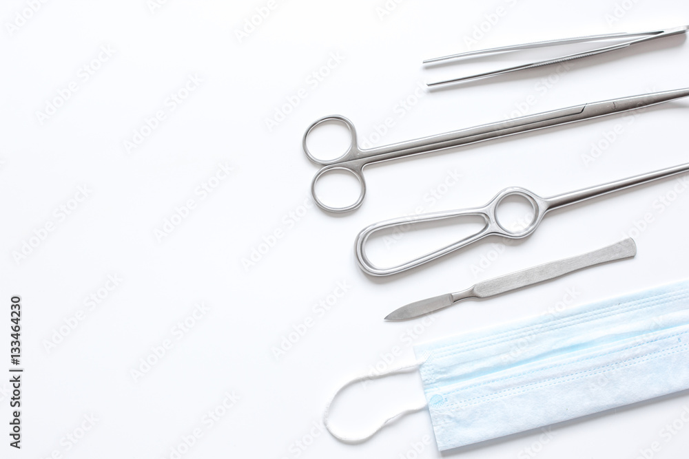 instruments for plastic surgery on white background top view instruments for plastic surgery on white background top view