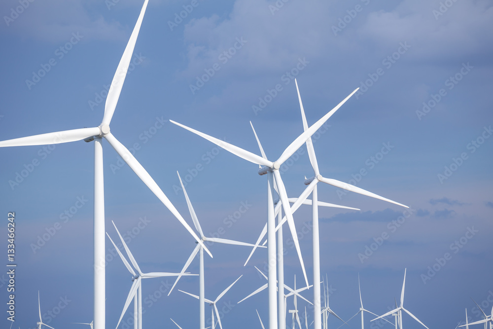 Close up of wind turbines in blue sky Close up of wind turbines in blue sky