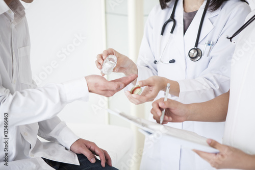 The doctor prescribes the medication to the patient