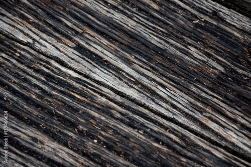 Wood pier, abstract texture of a natural gray. View of old weathered deck wooden board. Diagonal wood background texture. photo