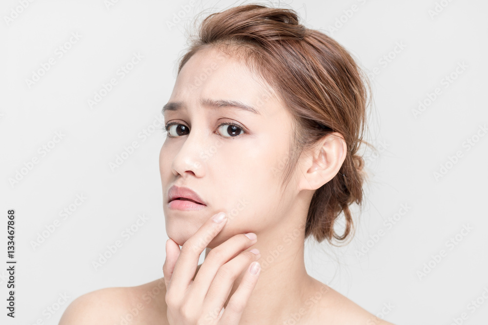 beauty girl of half latina and half asian who checks her skin, skin care, acne treatment beauty girl of half latina and half asian who checks her skin, skin care, acne treatment