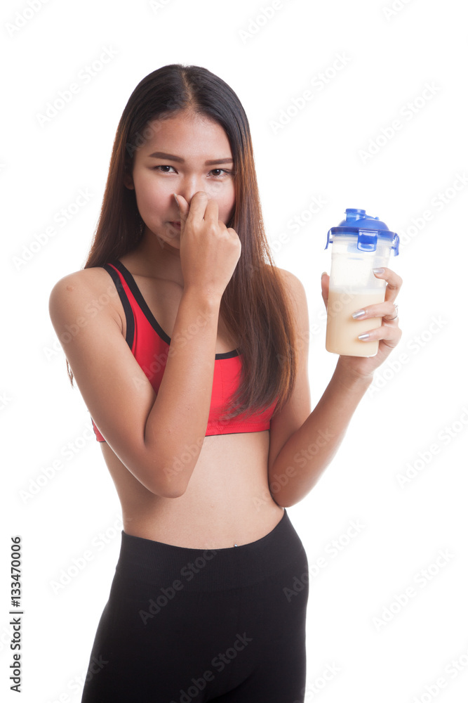 Beautiful Asian healthy girl hate whey protein smell. Beautiful Asian healthy girl hate whey protein smell.