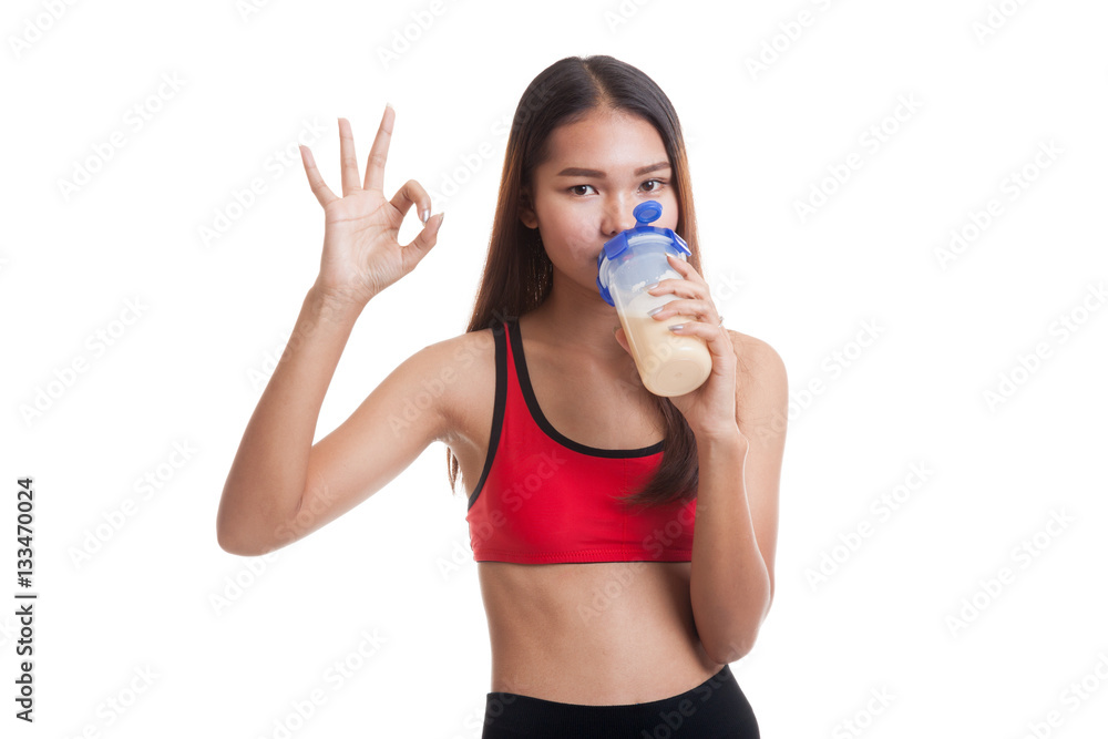 Beautiful Asian healthy girl show OK drink whey protein. Beautiful Asian healthy girl show OK drink whey protein.