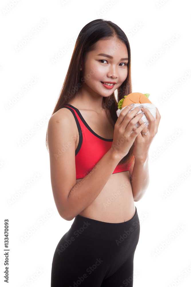 Beautiful Asian healthy girl enjoy eating hamburger. Beautiful Asian healthy girl enjoy eating hamburger.