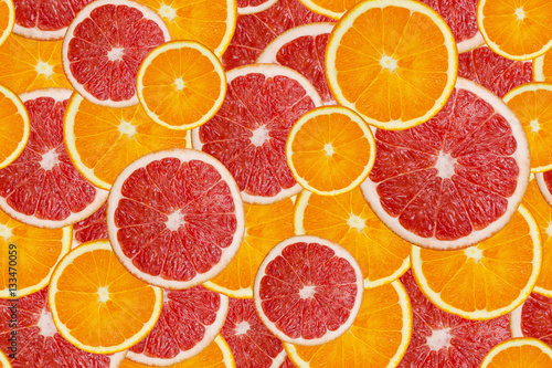 Slices of fresh orange and grapefruit seamless pattern