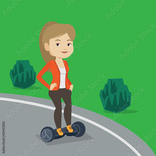 Woman riding on self-balancing electric scooter.