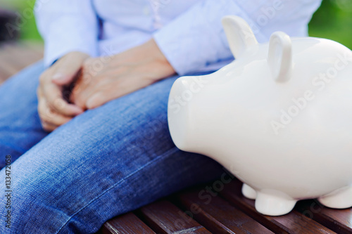 Piggy Bank on the background of a person.