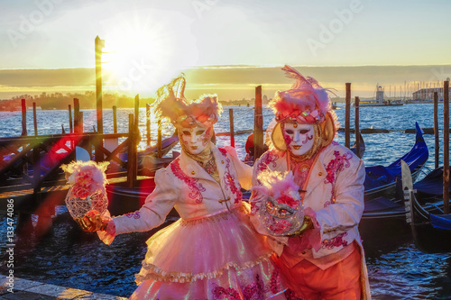 Famous carnival masks against gondolas in Venice, Italy © Tomas Marek