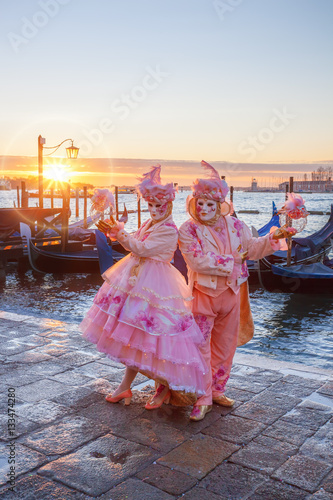 Famous carnival masks against gondolas in Venice, Italy © Tomas Marek