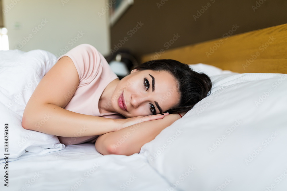 Young brunette girl wake up in the morning in her bed Young brunette girl wake up in the morning in her bed