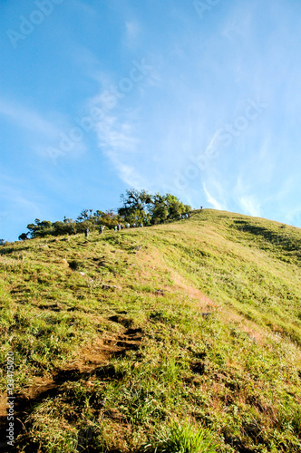 People climbing to the hill © sapgreen