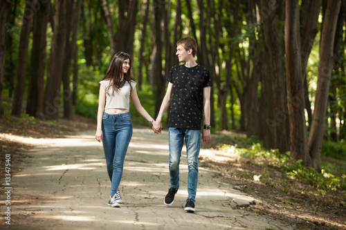 Couple walking in park and laughing