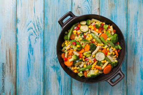 Mix of vegetables fried in a wok.