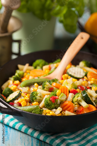 Mix of vegetables fried in a wok.