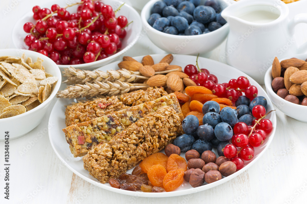 cereal muesli bars, fresh and dried fruit for breakfast, closeup cereal muesli bars, fresh and dried fruit for breakfast, closeup
