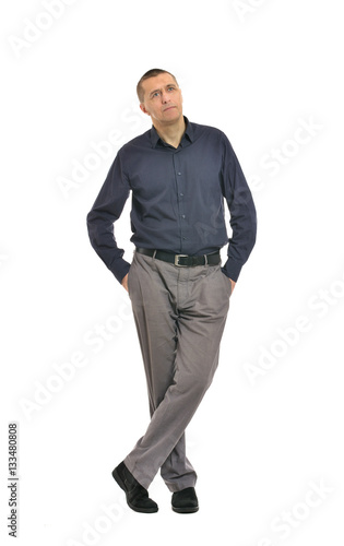 Full length portrait of a smiling man looking at camera with con