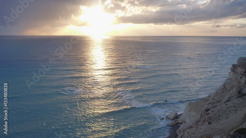 beautiful romantic sunset at a rocky seashore