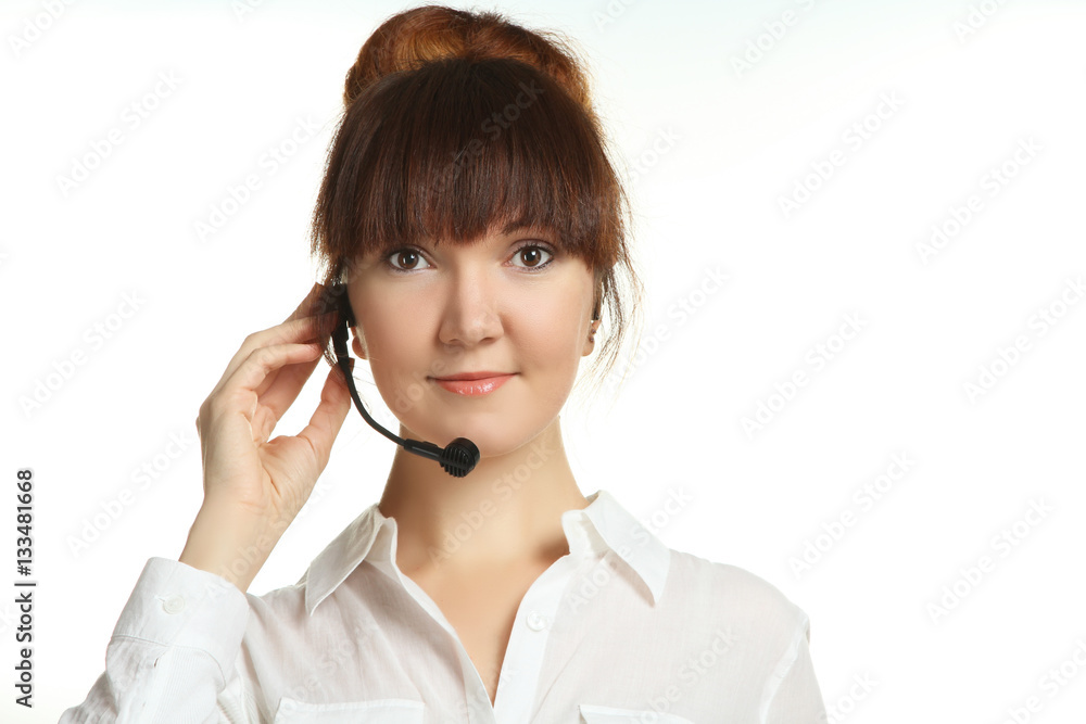 Portrait of a young smiling woman with headset working in a call center. Isolated. Portrait of a young smiling woman with headset working in a call center. Isolated.