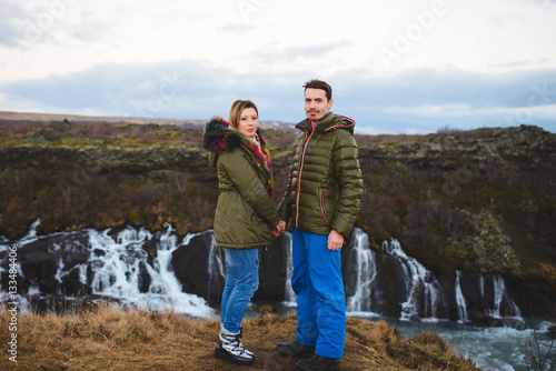 Couple Holding Hands on Hill
