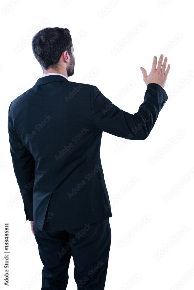 Businessman pretending to touch an invisible screen