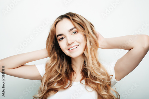 lifestyle and people concept: Young cute smiling curly girl