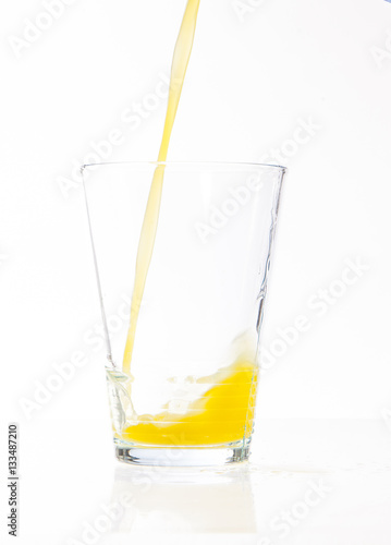 pouring glass of orange juice 