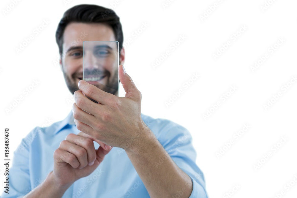Smiling man using futuristic mobile phone