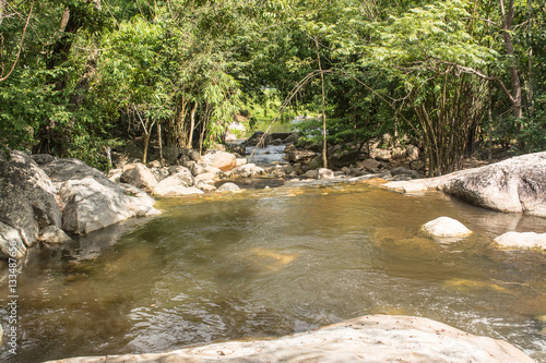 Nine dives waterfall falls from a cliff in the Central Valley Tenasserim mountain range located in Ratchaburi province Thailand.  photo