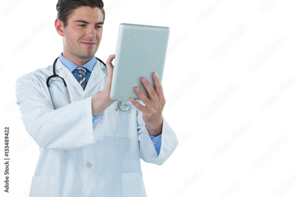 Doctor using a digital tablet against white background Doctor using a digital tablet against white background