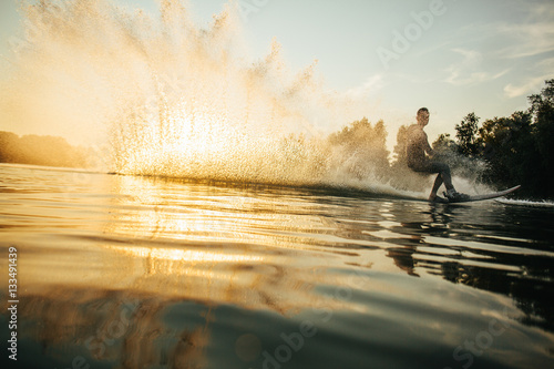 Man wakeboarding on a lake photo