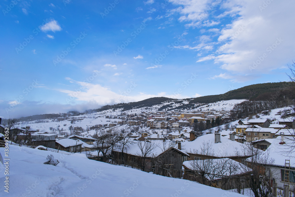Cloudy winter mountain village Cloudy winter mountain village