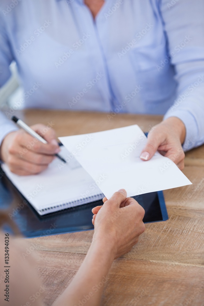 Doctor giving prescription to patient Doctor giving prescription to patient
