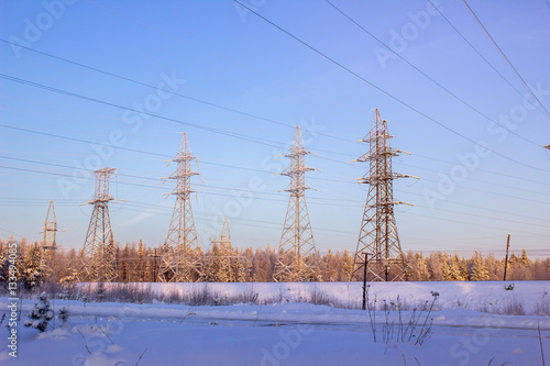 High voltage power lines in the winter. Winter landscape.