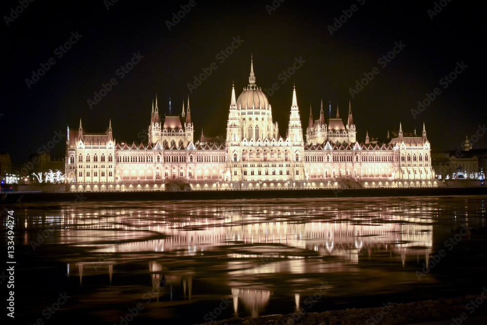 Floating ice at night at hungarian parliament Budapest, Hungary