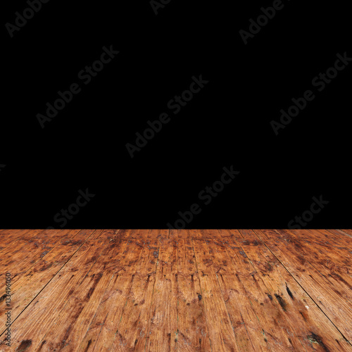 room with wooden floor and black wall