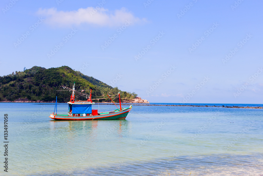 Colorful boat in bay at mountain background