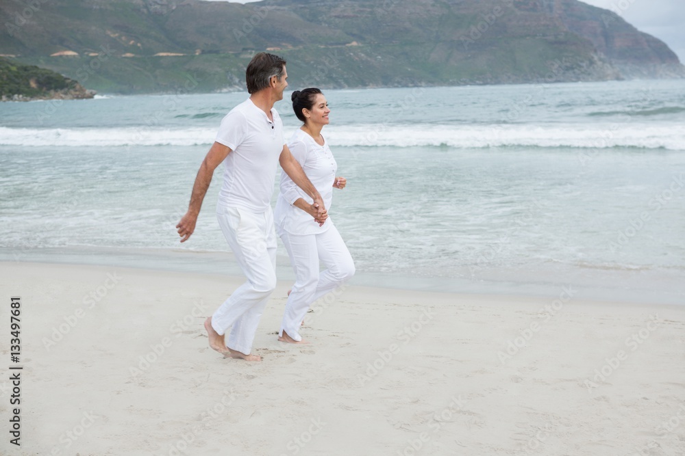 Romantic couple running on beach Romantic couple running on beach