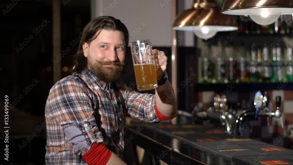 Red Bearded man drinking beer in a bar Red Bearded man drinking beer in a bar