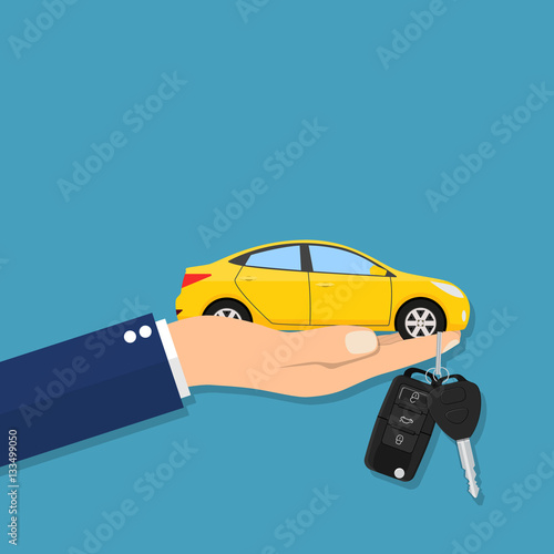 Car seller hand giving key to buyer