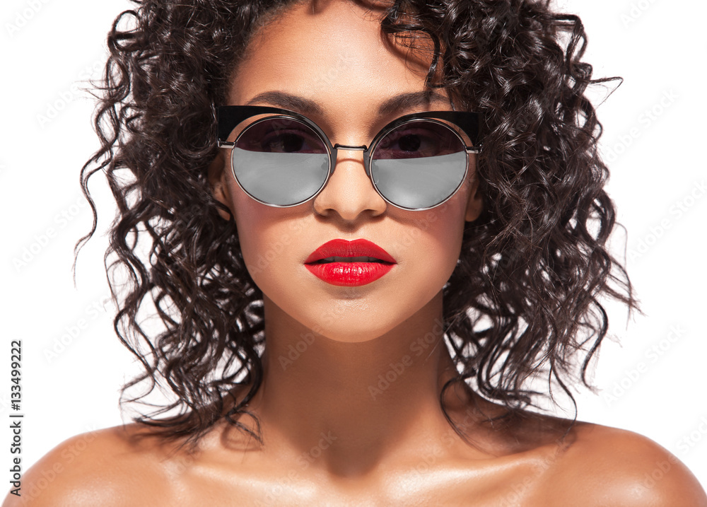 beauty woman in glasses with red lips over white background